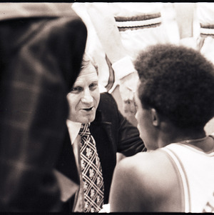 Basketball coach and players at NC State versus Virginia game, circa 1972-1975