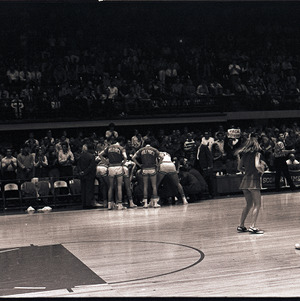 Basketball players and cheerleaders at NC State versus Virginia Tech game, 1970