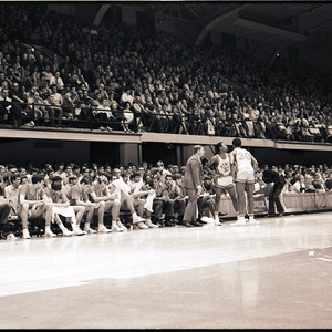 Basketball players and coaches at NC State versus Virginia Tech game, circa 1969-1975
