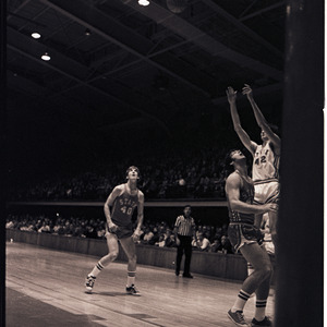 Basketball players feat. Dan Wells and referee at NC State scrimmage, circa 1969-1975