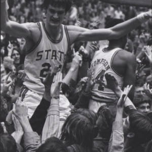 Team celebration after NCAA championship, with Tommy Burleson and David Thompson being carried, March 25, 1974