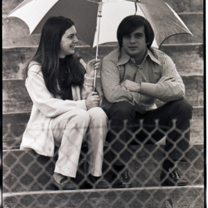 Spectators watching pole-vaulting, circa 1969-1975
