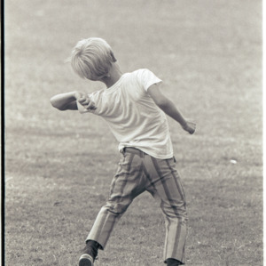 Child on rugby field, circa 1969-1975