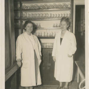 Mary Yarbrough and a colleague in lab coats