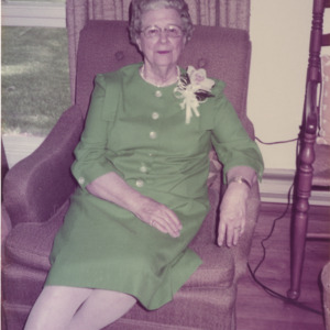 Mary Yarbrough, seated, in a green dress