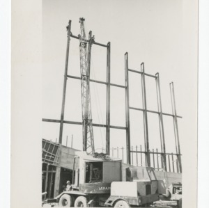 Crane being operated on construction site of Dorton Arena, 1951-1952