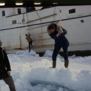 Chopping out ice to free ship, Maggie Island