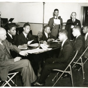 Photo of Young Men in a Conference