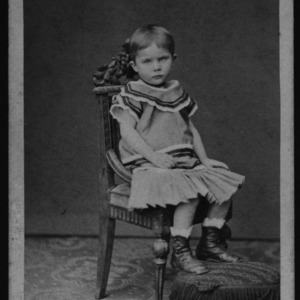 Child sitting in chair
