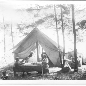 Dr. Carl Schenck and Adele Schenck in front of tent