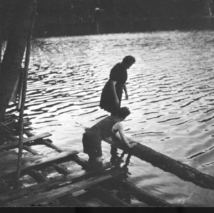Two people on lakeshore