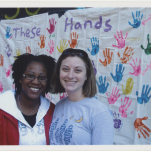 Students in Front of Handprint Display