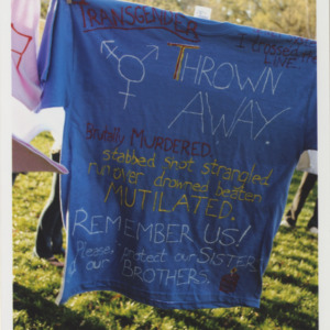 Blue T-Shirt with painted Text on Clothes Line