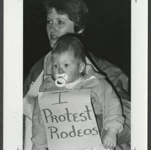 Mom and baby at rodeo protest