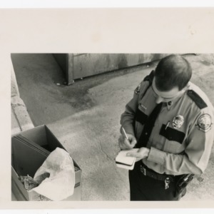 Officer Mueller and Carcass in box