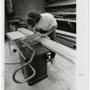 Student sawing wood