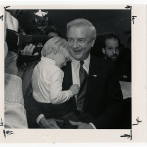 Jim Hunt with his grandchild at the Democratic Convention