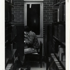 Student studies in the ninth floor carrels at D. H. Hill Jr. library
