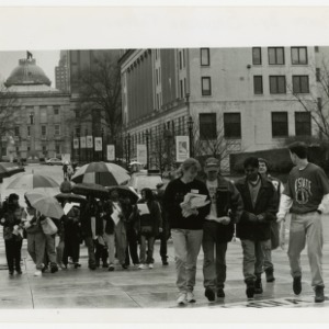 Student rally at the State Legislature on a rainy day