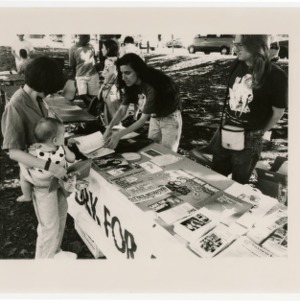 Students work at the "N.C. Network for Animals" table during the Compassionate Living Event