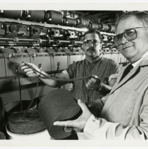 Two researchers holding rope product