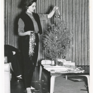 Carolyn Patrick decorating Christmas tree