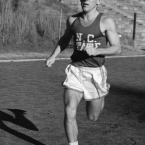 Team captain Jim Tyson running in field