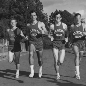 Mile relay team running on track