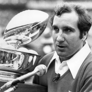 Coach with trophy at 1977 Peach Bowl