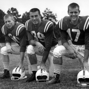 Football players Charlie Tayloe, Bob Shelton, and Bill James