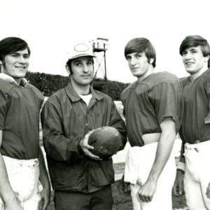 Football players and assistant coach Bo Rein