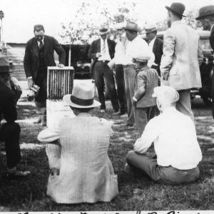 C. L. Sams giving demonstration on bee colonies at J. R. Pinkham's apiary