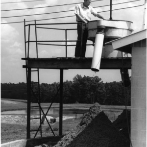 Man on structure at farm