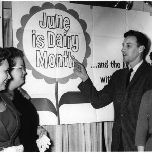Group in front of "June is Dairy Month" sign