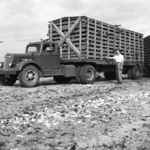 Max Parker, manager of Monroe Turkey Processing Plant, with turkey carrying trailer