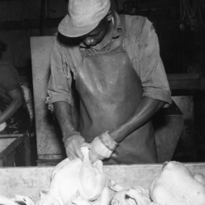 Man preparing turkeys at Peachland Dressing Plant