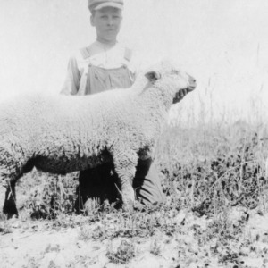 Young man with lamb he raised