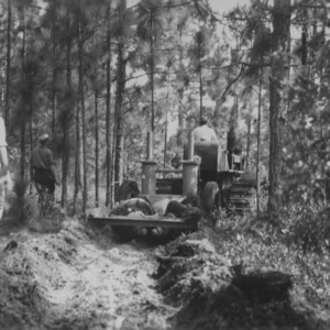 Tractor and fire plow making at Forest Camp