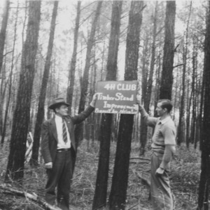 Adrian Lamb and J.P. Stovall look over the timber thinning project conducted by Adrian in competition for the award trip