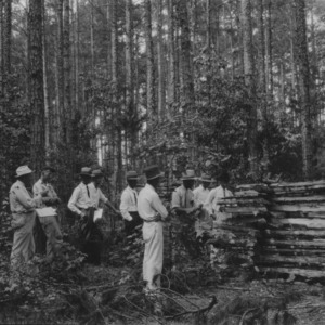 Group of farmers in stovewood cutting of I.J. Jackson, Vance County