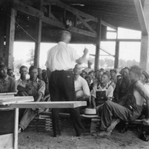 D. P. Price giving lecture on mill operation at Saw Mill School