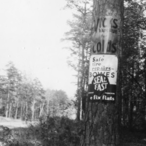 Road-side advertisement unlawfully placed on timber
