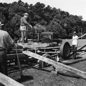 Men sawing timber