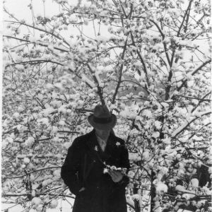 John Goodman with snow-covered tree
