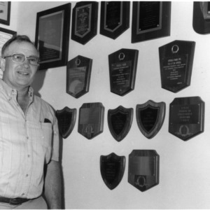 Small Grain Association President Madison Angell with plaques
