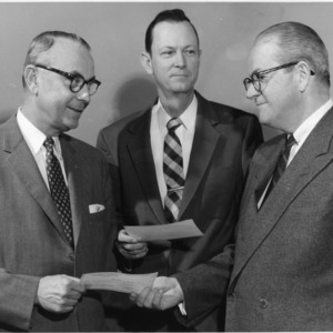 Robert Schoffner and two other men with awards
