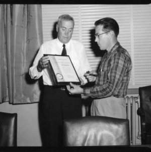 Two men with award