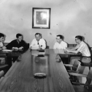 Men at conference table