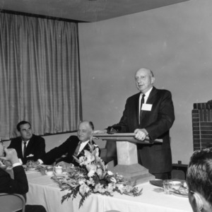 Man Addressing Group at Banquet