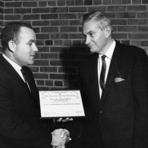 George Hyatt Accepting Certificate from American National Red Cross